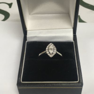 A 14ct white gold diamond cluster ring, approx 1.9g and approx size N. Shipping category A.