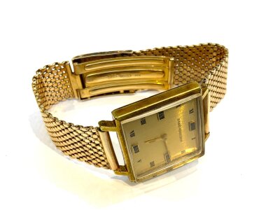 A vintage gold plated Girard-Perregaux with a later attached 14ct gold watch strap, 41.5g total weight.
