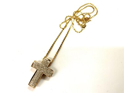 A 9ct gold pave set diamond cross pendant and chain. 5.3g