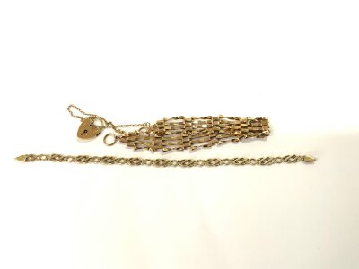 A 9ct gold gate bracelet together with a 9ct gold twist bracelet. 14g.