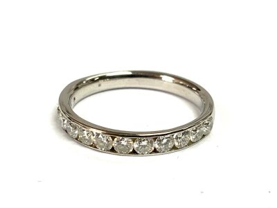 An 18ct white gold and diamond half eternity ring set with approximately 13 x 0.8ct brilliant cut stones, Size L