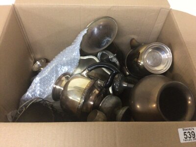 A box containing silver plate and brass ware