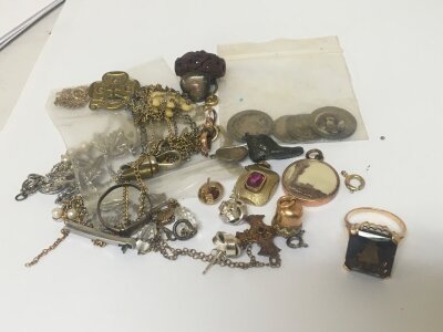 A gold ring set with a large smoked quartz and quantity of other jewellery silver earrings coins and other oddments