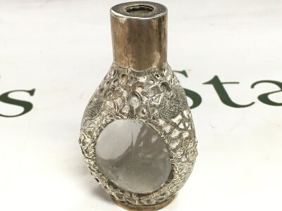 A Chinese style dragon and phoenix design sterling silver and glass snuff bottle signed, 9cm tall. Made in Hong Kong