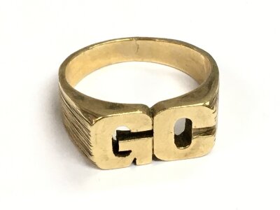 A 9ct gold GC ring, size V. 9.7g total weight