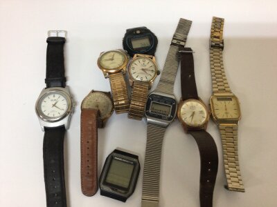 A collection of gents Vintage watches including an Oris watch (seen working) digital watches and others sold as seen.