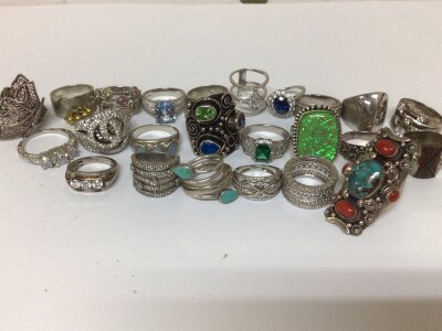 A collection of twenty five silver rings mixed designs set with coloured stones and CZ weight 225g