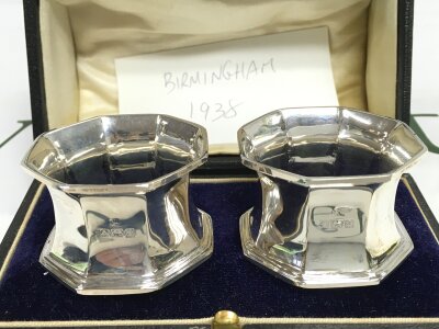A cased pair of silver napkin rings, Birmingham 1938 . 61.2g total weight