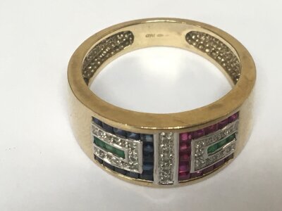 A 9carat gold ring set with a geometric pattern of small diamonds sapphire ruby and emerald weight 5.5g ring size T-U