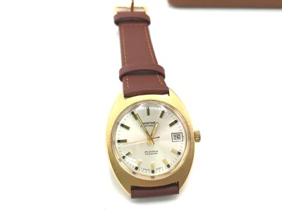 Montane vintage automatic date gold plated Watch with original box seen running.
Approx 35 mm case.