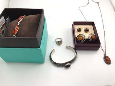 A collection of assorted silver and amber jewellery including bracelet earrings etc