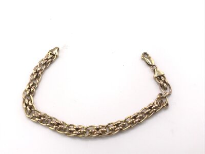 A 9ct gold bracelet. 
7.40g
