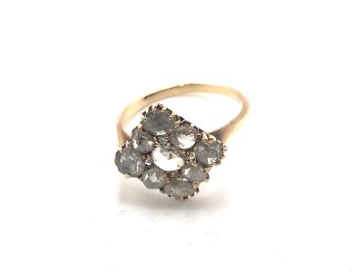 An unmarked high carat gold ring set with diamonds. 
Size N and 3.15g