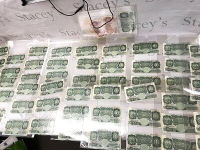 A collection of over 50 old one pound Bank of England notes