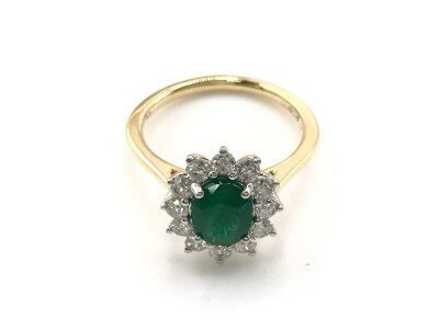 18ct yellow and white gold cluster ring set with an oval emerald and surrounded by RBC diamonds. With cert.
Size M