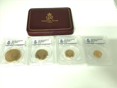 A 1937 graded proof set of gold sovereigns including 5 sovereign 2 sovereign 1 sovereign and 1/2 sovereign. Comes with original 1937 case.