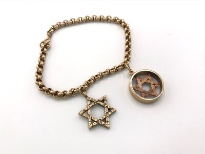 A 9ct gold bracelet with two Star of David charms.
18.72g