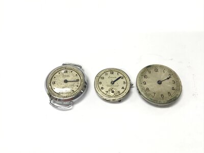 A Rolex Oyster chrome cased vintage ladies watch no strap and in need of repair and two vintage movements.