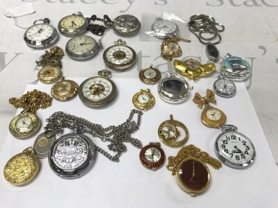 A collection of assorted pocket watches and stop watches.