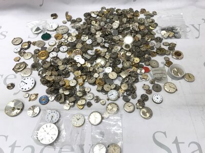 A large collection of Watch movements and dials from various markers like Longines Smiths Rotary etc.
