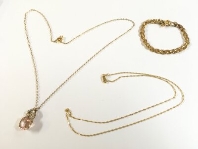 A 9ct bracelet and two 9ct gold necklaces one with a gemstone pendant. 11g total weight