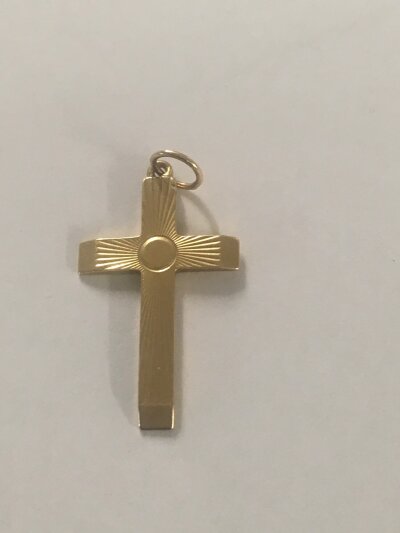 A gold cross pendant 4 grams.