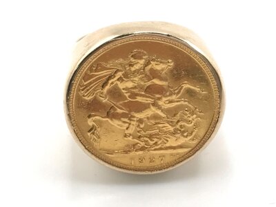 A 1927 full sovereign with SA mint mark set in 9ct gold ring.
18.86g and size S 1/2