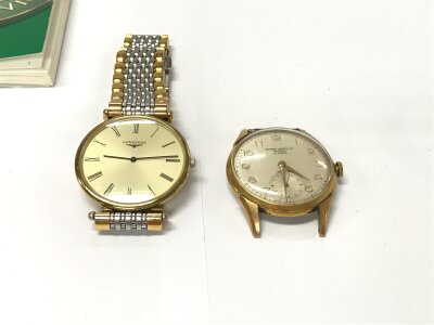 A gents Longines watch and a Record watch without strap.
