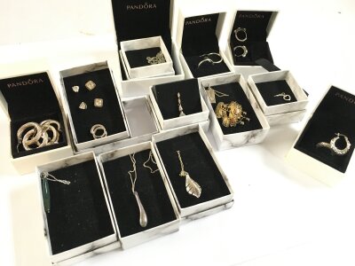 A collection of silver jewellery including pendant necklaces, earrings etc