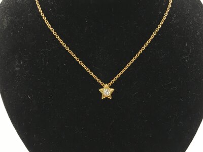 An 18ct yellow gold necklace with star shaped stone set pendant.