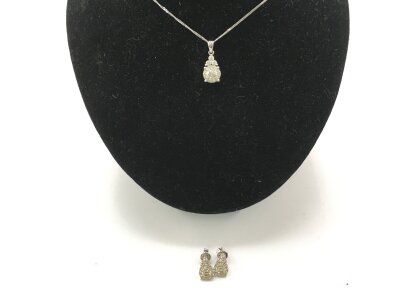 An 18ct white gold necklace with matching earrings.