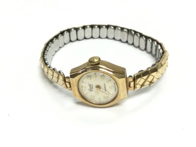 A 9ct gold cased ladies watch with a later strap (not gold).
14.62g