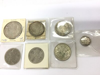 A collection of coinage including George VI half crowns 1884 silver dollar and George III 1817 3d