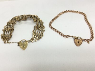 Two 9ct gold bracelets both with heart shaped padlocks.
23.49g total.