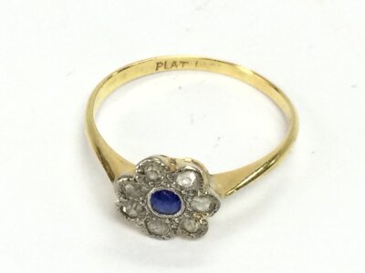 An 18ct and platinum sapphire and diamond cluster ring size Q and 2.03g