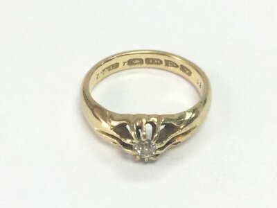 An 18ct gold diamond solitaire ring. Size Q 1/2 and 6.03g