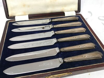 A cased set of silver hallmarked handled knives, 16cm long