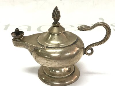 A small silver hallmarked Aladdin table lamp . Approximately 9cm tall, 11cm wide. Birmingham 1898. 100g total weight