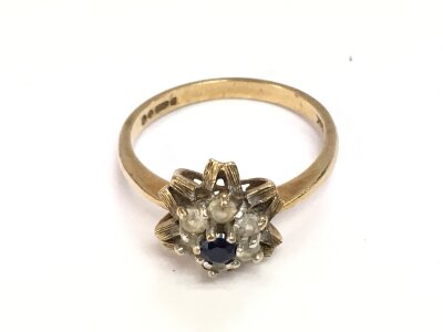 A 9ct gold ring set with a sapphire. Size Q and 2.93g