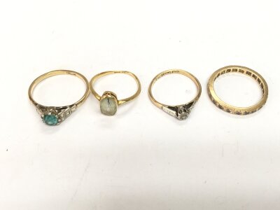 Four 9ct gold rings set with various stones. 7.09g