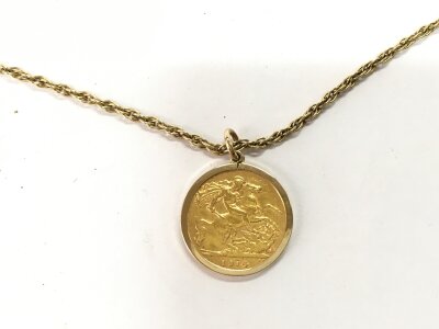 A 1914 half sovereign in mount on chain. 10.50g