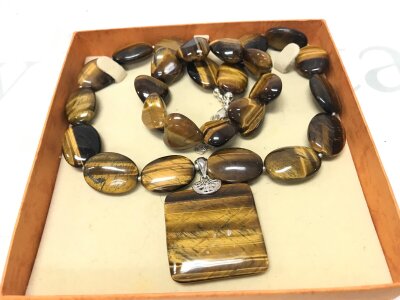 A silver and tiger eye beaded necklace and bracelet