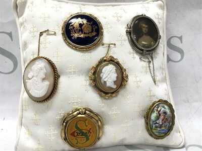 A Collection of vintage brooches including Victorian, limoges etc
