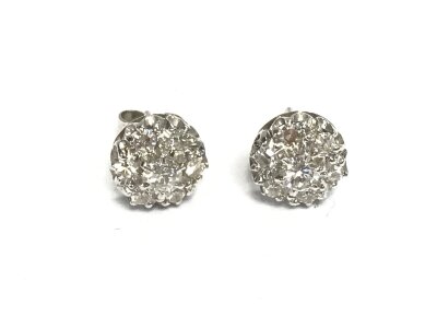 A pair of 9ct white gold diamond earrings.