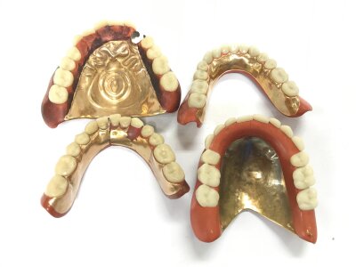 A collection of gold mounted dentures.