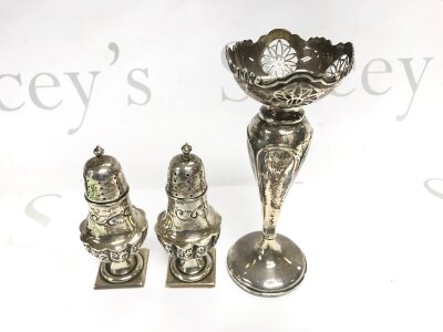 A pair of silver salts and a vase.
Approximately 162g