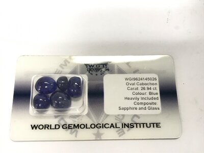 A sealed parcel of 5 cabochon sapphires glass filled with cert.