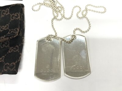 A set of boxed silver Gucci dog tags.
48.93g