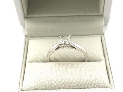 A 18ct white gold solitaire diamond rings. Princess cut 0.57ct.
Size M and 3.52g
