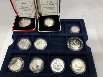 A collection of 6 fine silver 10 dollar coins and four sterling silver coins.